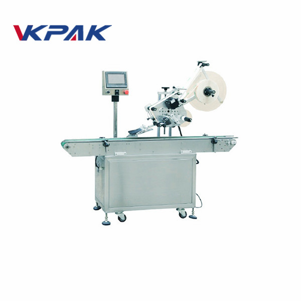 Itsekiinnittyvä etiketöintikone jään tiilen yläpuolelle